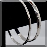 J065. 2 Silver bangles with Swarovski crystal studs. - $24 